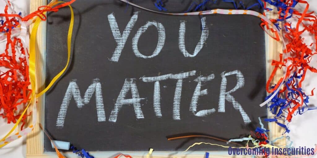 The picture features a chalkboard with the words "You Matter" written in bold, expressive lettering. The message is simple yet powerful, serving as a reminder of self-worth and importance. The contrast between the dark chalkboard background and the white chalk letters creates a visually striking image that conveys a message of encouragement and positivity. This image can serve as a daily affirmation to boost confidence and remind individuals of their value.