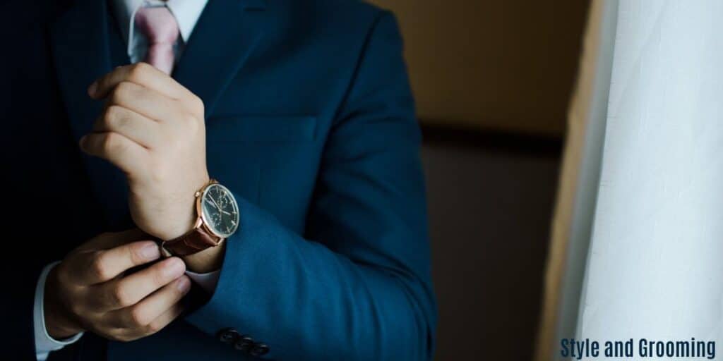 an image on a man dressed in a nice suit and holding a nice watch. Looks really smart.