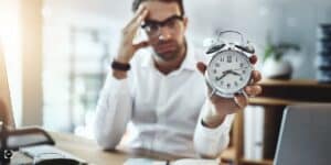 a man holding a clock