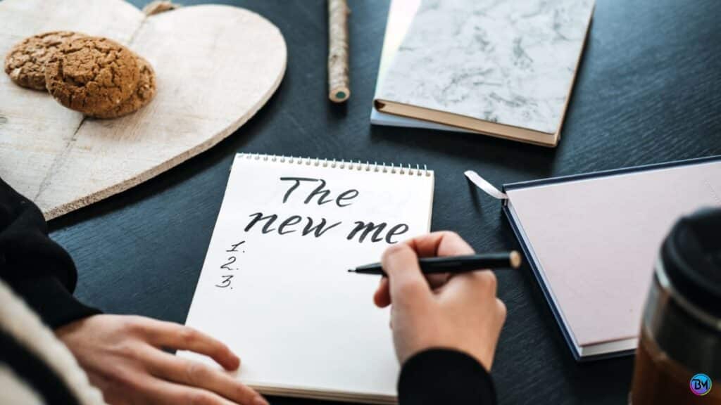 a person writing on a notebook