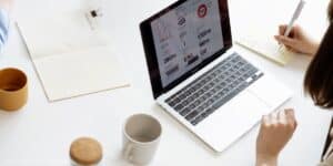 a laptop and coffee mug on a well organized table