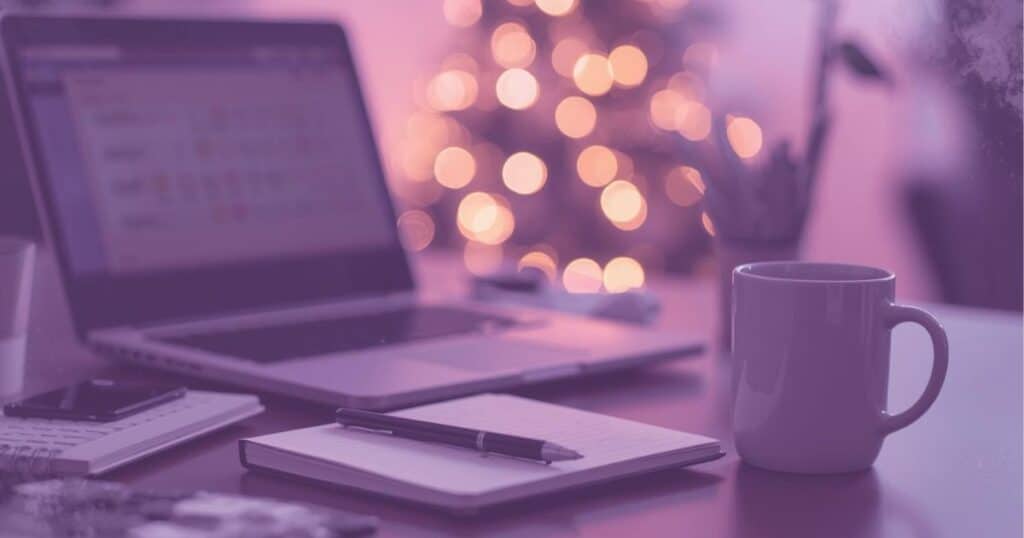 The Solopreneur Reality: December Isn’t a Break — It’s an Opening 2 Minimalist workspace showing a solopreneur working during the holiday season, representing solopreneur holiday tips.