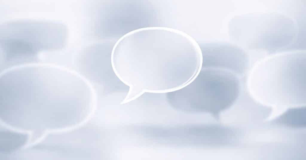 A single clear speech bubble standing out from blurred ones, symbolizing simple and focused communication.