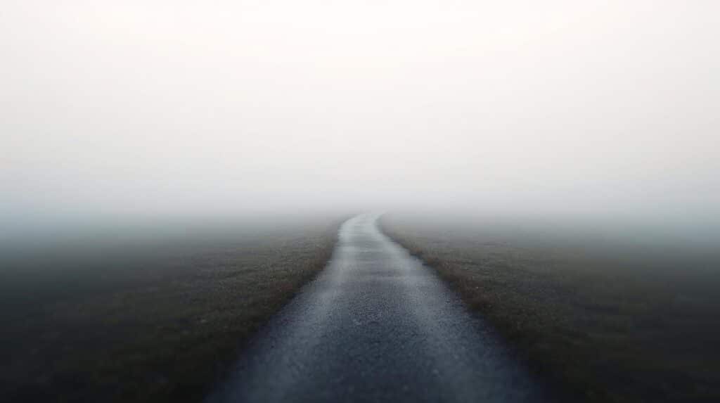 Minimal landscape with a single narrow path, representing focus and clear direction