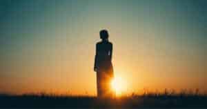 Person standing in morning light representing a moment of self-discovery and motivation.
