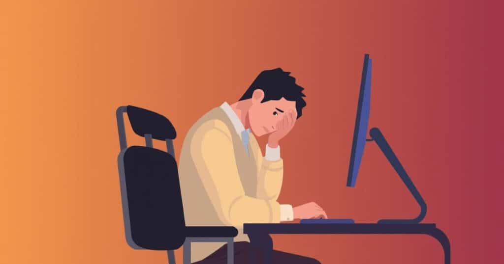 Illustration of an exhausted professional slumped at desk representing burnout and fatigue for the burnout quiz