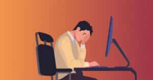 Illustration of an exhausted professional slumped at desk representing burnout and fatigue for the burnout quiz