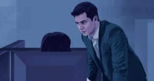 Manager looking over employee's shoulder at computer screen - micromanagement in the workplace